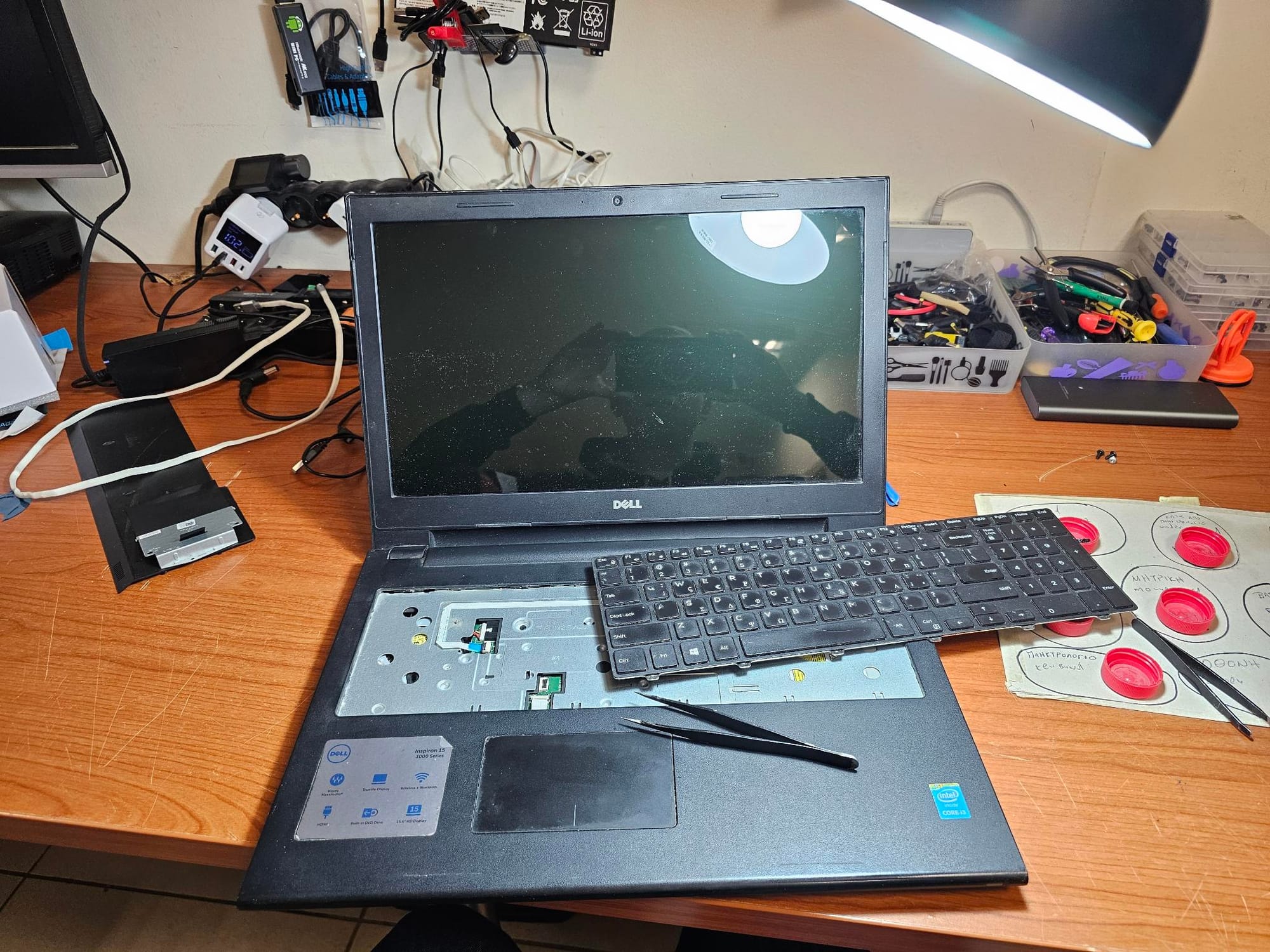 A Labtop that is opend up, with removed Keyboard